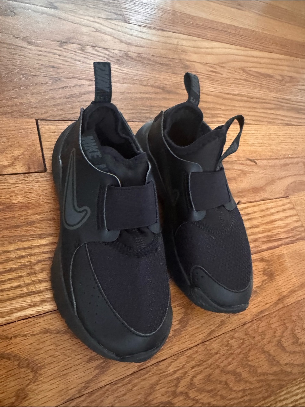 Nike Kids Black Slip-On Athletic Sneakers with Reflective Swoosh Accent